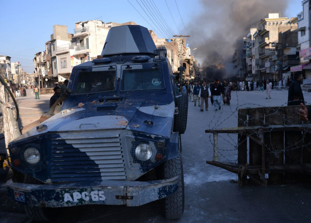 a police armoured vehicle leaves the site following clashes in rawalpindi on november 15 2013 photo afp a police armoured vehicle leaves the site following clashes in rawalpindi on november 15 2013 photo afp