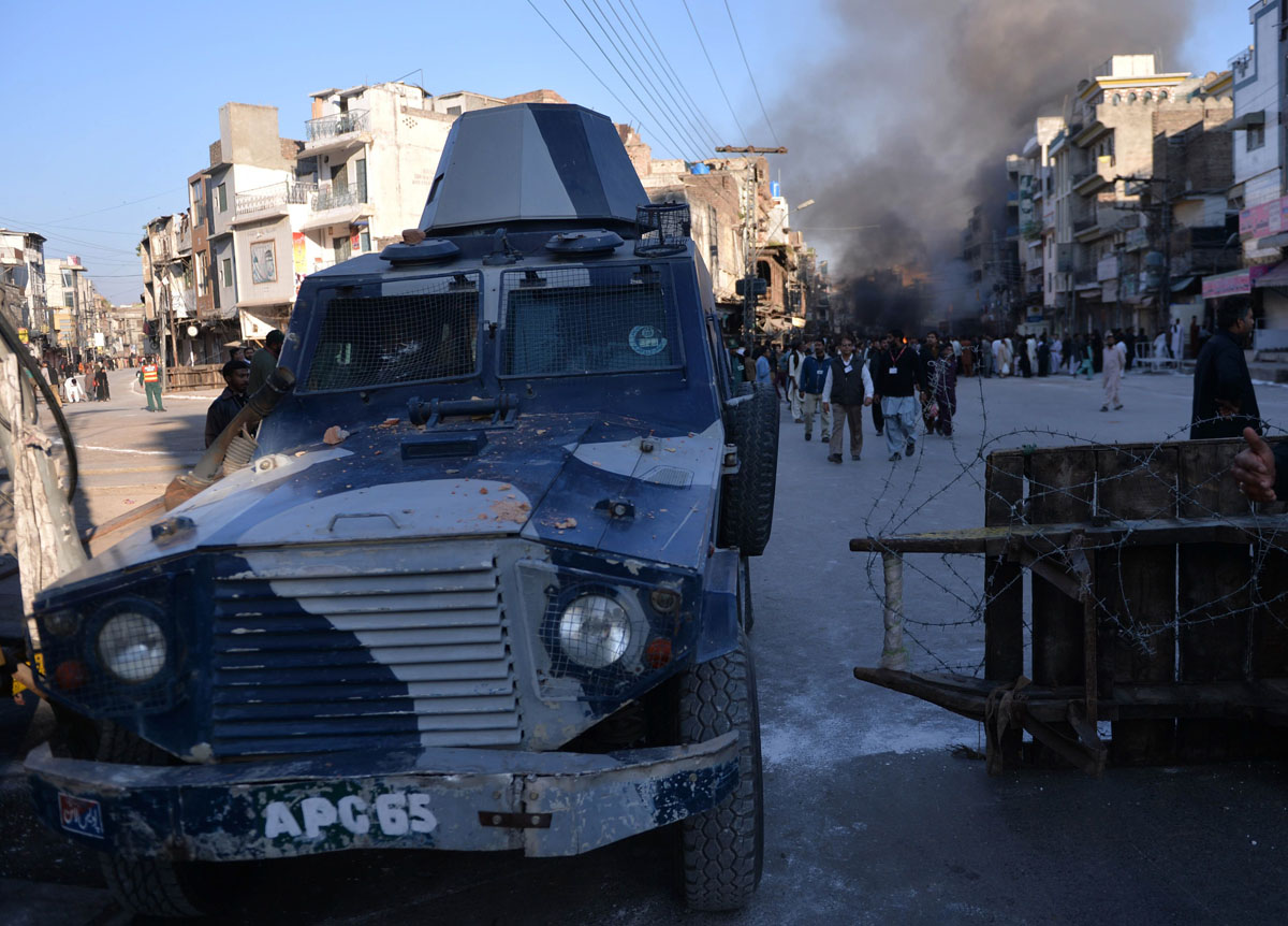 a police armoured vehicle leaves the site following clashes in rawalpindi on november 15 2013 photo afp