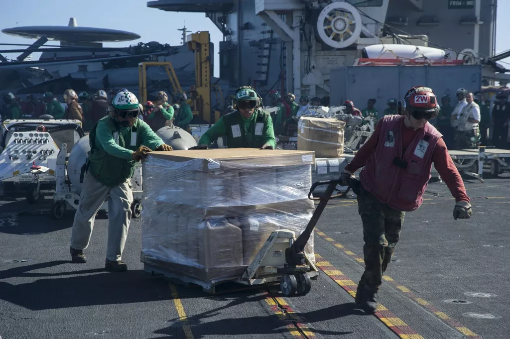 sailors aboard the aircraft carrier uss george washington move a pallet of fresh drinking water across the flight deck for delivery ashore in support of operation damayan in the philippines photo reuters sailors aboard the aircraft carrier uss george washington move a pallet of fresh drinking water across the flight deck for delivery ashore in support of operation damayan in the philippines photo reuters