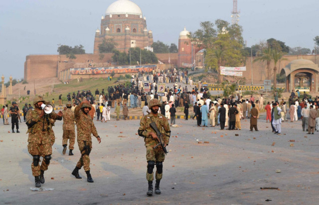 army units foreground deployed along with heavy contingents of police background in multan following clashes photo shahid saeed express army units foreground deployed along with heavy contingents of police background in multan following clashes photo shahid saeed express