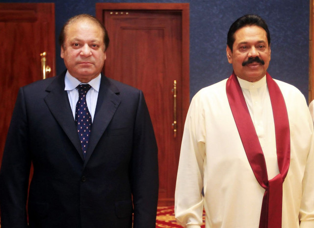 pakistan prime minister nawaz sharif l poses with sri lanka prime minister mahinda rajapaksa during a banquet dinner for the commonwealth heads of government meeting chogm in colombo november 16 2013 photo reuters