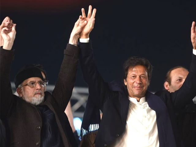 canada based pakistani cleric tahir ul qadri l of pakistan awami tehreek pat and pakistani opposition leader and head of the pakistan tehreek e insaf pti imran khan raise hands during an anti government protest rally in lahore on january 17 2018 photo afp canada based pakistani cleric tahir ul qadri l of pakistan awami tehreek pat and pakistani opposition leader and head of the pakistan tehreek e insaf pti imran khan raise hands during an anti government protest rally in lahore on january 17 2018 photo afp
