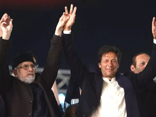 canada based pakistani cleric tahir ul qadri l of pakistan awami tehreek pat and pakistani opposition leader and head of the pakistan tehreek e insaf pti imran khan raise hands during an anti government protest rally in lahore on january 17 2018 photo afp canada based pakistani cleric tahir ul qadri l of pakistan awami tehreek pat and pakistani opposition leader and head of the pakistan tehreek e insaf pti imran khan raise hands during an anti government protest rally in lahore on january 17 2018 photo afp