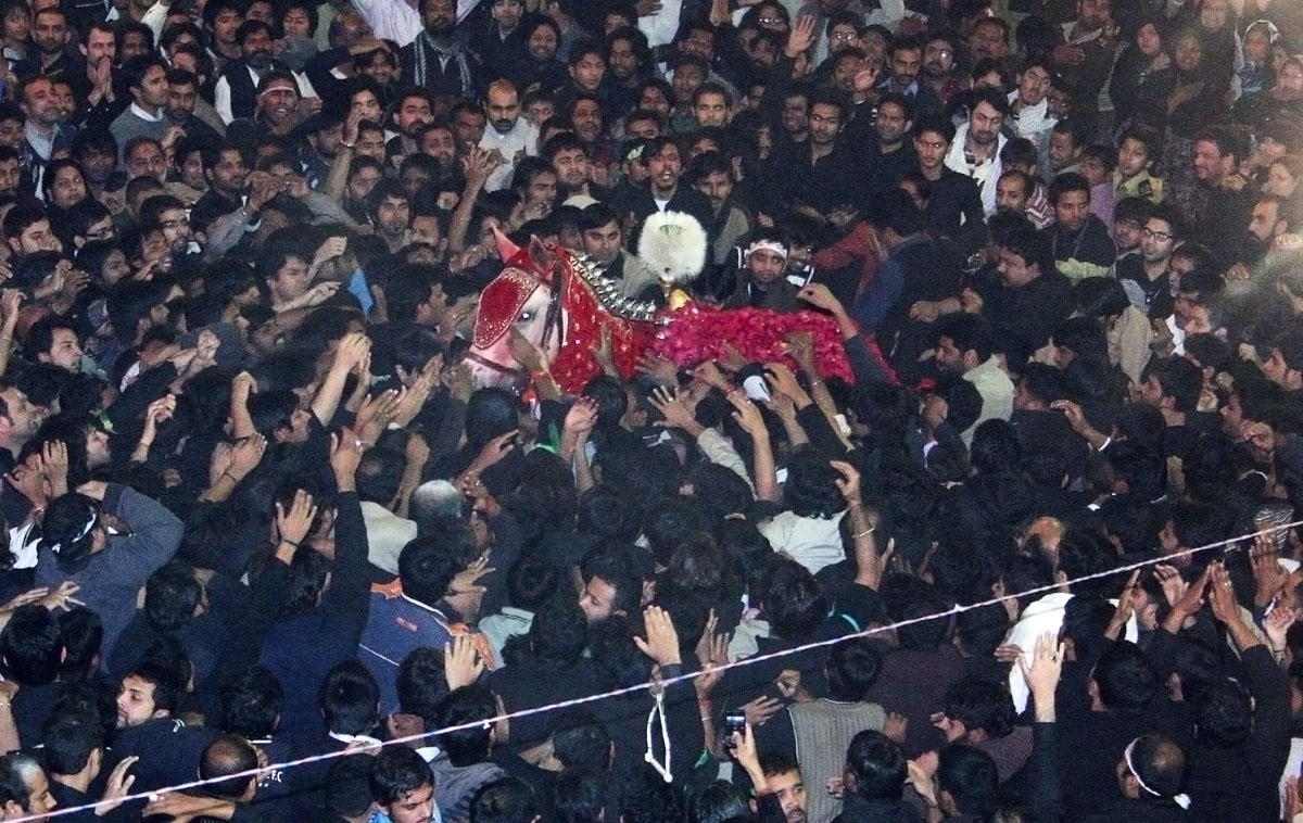 mourners take part in mourning processions on muharram 9 photo shafiq malik express tribune