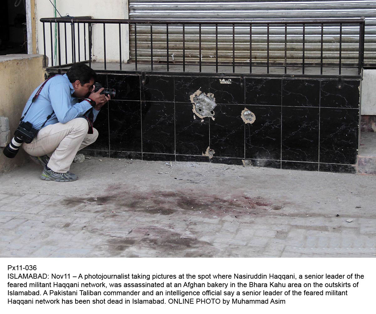 a photojournalist taking picture at the place where nasiruddin haqqani was assassinated photo onlie