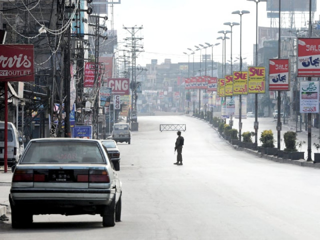 an army soldier keeps watch during a curfew in rawalpindi photo afp an army soldier keeps watch during a curfew in rawalpindi photo afp