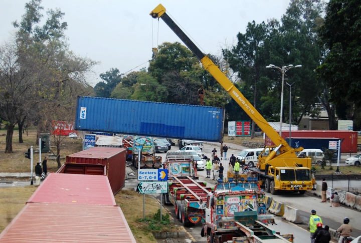 containers being placed around islamabad 039 s red zone to prevent protesters advancing photo muhammad javaid express