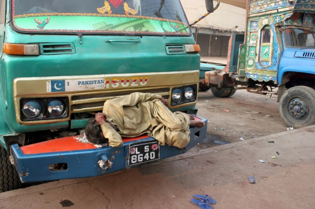 truck driver is sleeping due to unemployment during strike of goods transporters association near fishery photo ppi truck driver is sleeping due to unemployment during strike of goods transporters association near fishery photo ppi