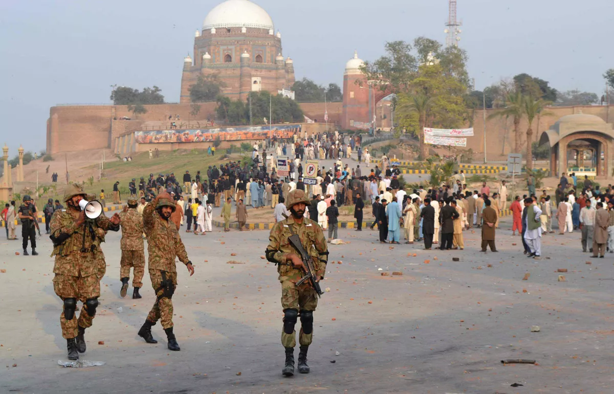 army units foreground deployed along with heavy contingents of police background in multan following clashes photo shahid saeed express army units foreground deployed along with heavy contingents of police background in multan following clashes photo shahid saeed express