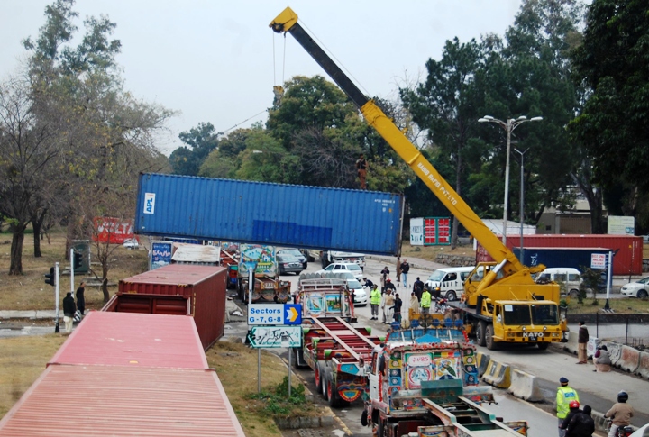 cargo containers are usually used by the islamabad police to cordon off the red zone in order to prevent protest demonstrations to move close to sensitive installations photo muhammad javaid express