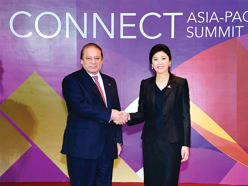 pm nawaz sharif is received by thai prime minister yingluck shinawatra at the itu connect asia pacific summit photo app