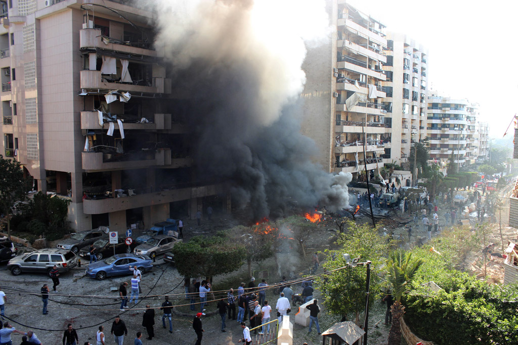 flames rise from the site of a blast in bir hassan neighbourhood in the southern beirut on november 19 2013 photo afp