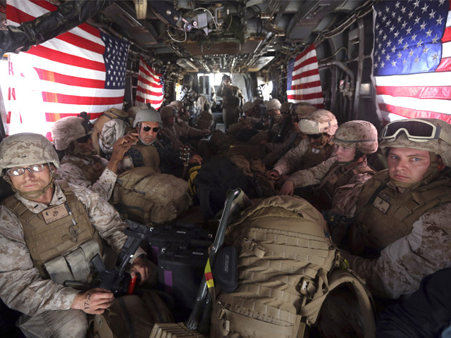 us marines are seen on board a helicopter at kandahar air base upon the end of operations for the marines and british combat troops in helmand october 27 2014 photo reuters