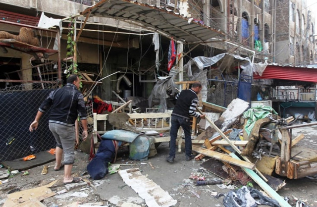 iraqi men clean the rubble at the site of a blast that took place the previous day outside a cafe baghdad 039 s bayaa neighborhood on november 21 2013 photo afp iraqi men clean the rubble at the site of a blast that took place the previous day outside a cafe baghdad 039 s bayaa neighborhood on november 21 2013 photo afp