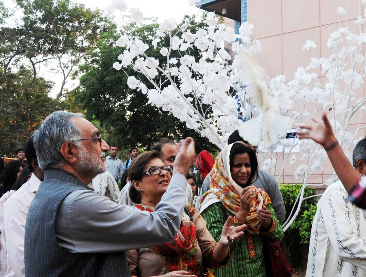 provincial minister for works and services mir hazar khan bijarani releases a dove as he inaugurates the pursukoon karachi festival photo irfan ali express