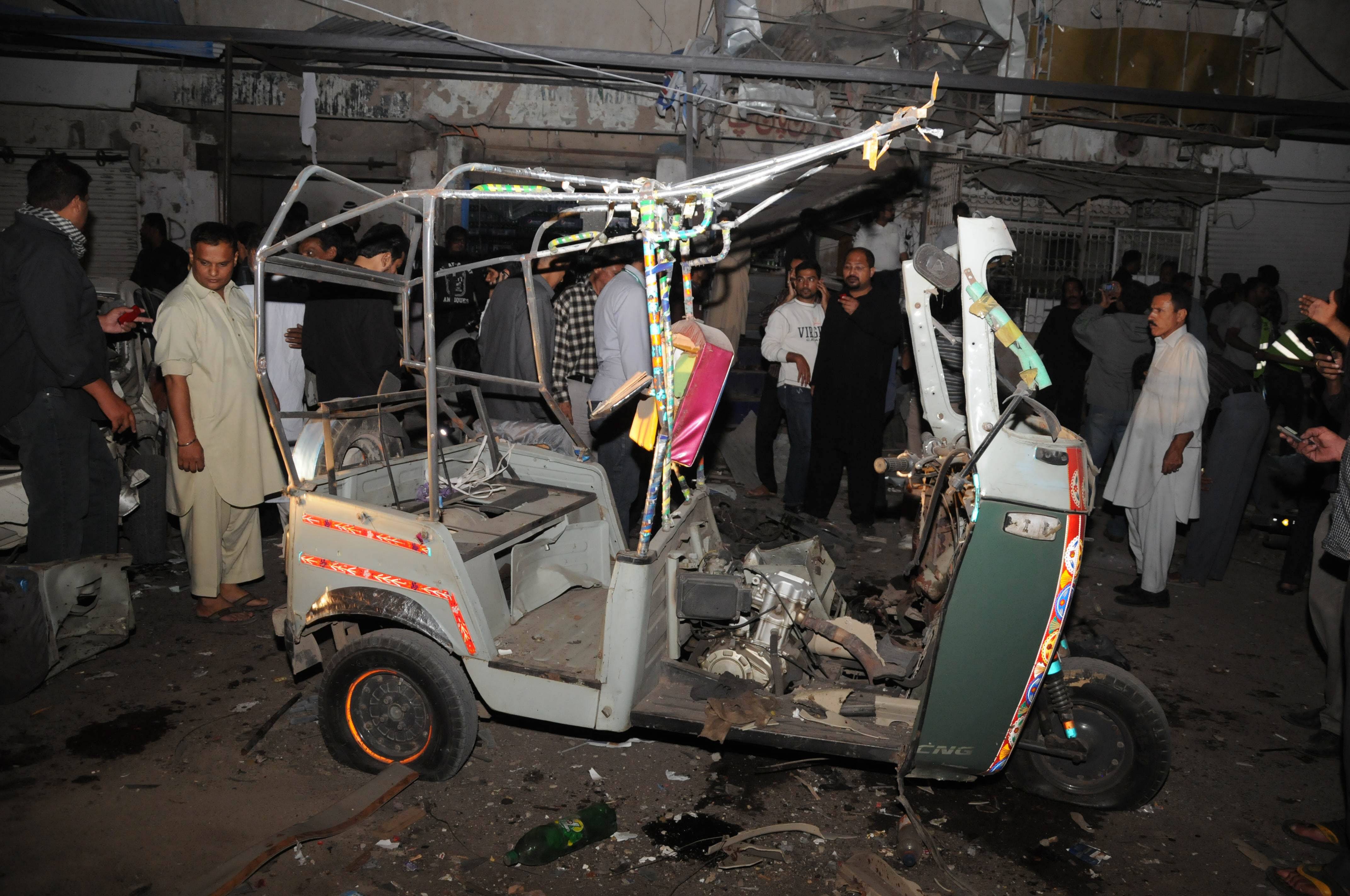 one rickshaw one motorcycle two cars and four shops were destroyed in the blast photo express mohammad noman