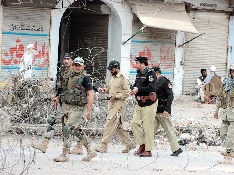 above qissa khwani bazaar was well fortified in anticipation of protests which had been planned across the province below protestors gather at shoba chowk photos muhammad iqbal express ppi