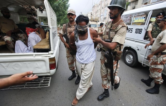 file photo of ranger personnel arresting suspects in karachi photo reuters file file photo of ranger personnel arresting suspects in karachi photo reuters file
