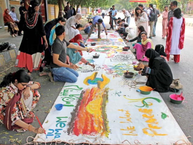 students artists and other participants took part in the interactive mural painting titled aik aur jahan mumkin hai at the road adjacent to napa and the arts council photo ayesha mir express athar khan express students artists and other participants took part in the interactive mural painting titled aik aur jahan mumkin hai at the road adjacent to napa and the arts council photo ayesha mir express athar khan express