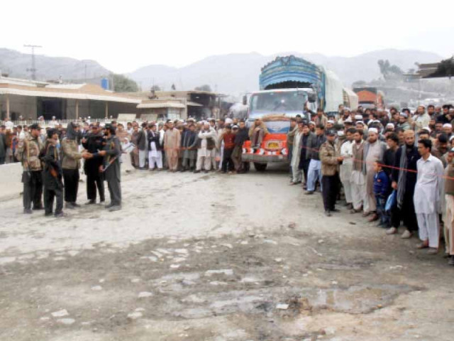 people wait at torkham border which has been closed due to security reasons and presumably the protest in peshawar against nato supply routes photo inp people wait at torkham border which has been closed due to security reasons and presumably the protest in peshawar against nato supply routes photo inp