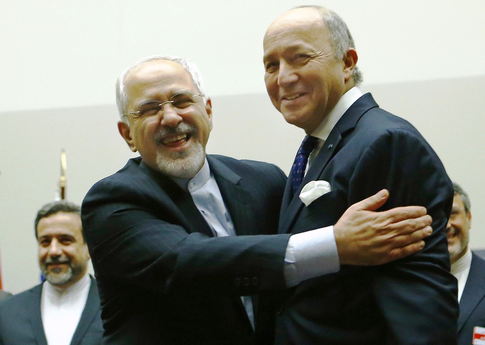 iranian foreign minister mohammad javad zarif hugs french foreign minister laurent fabius after a ceremony at the united nations in geneva november 24 2013 photo reuters