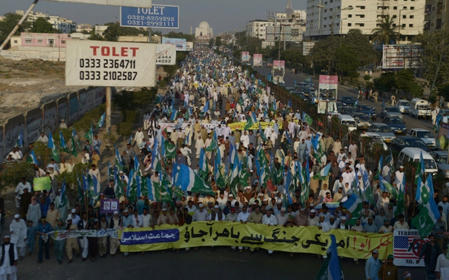 activists of jamaat e islami pakistan march in a protest rally in karachi on november 24 2013 photo afp