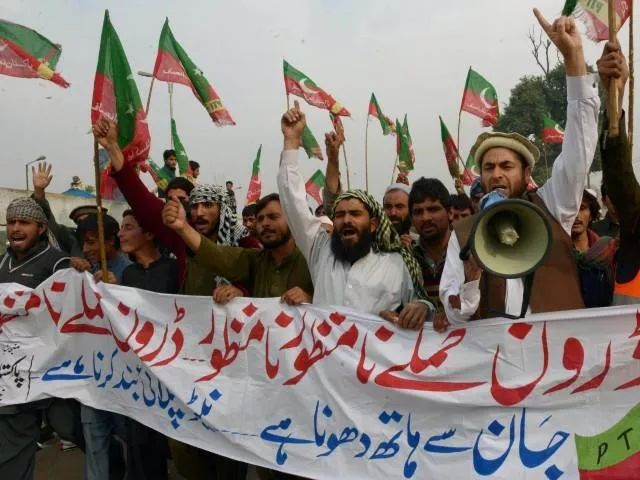 activists of pakistan tehreek e insaaf pti shout slogans as they arrive to attend a protest rally in peshawar on november 23 2013 photo afp activists of pakistan tehreek e insaaf pti shout slogans as they arrive to attend a protest rally in peshawar on november 23 2013 photo afp