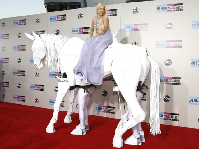 mother monster made a dramatic entrance as she arrived on the red carpet sitting atop a horse puppet powered by two men mother monster made a dramatic entrance as she arrived on the red carpet sitting atop a horse puppet powered by two men