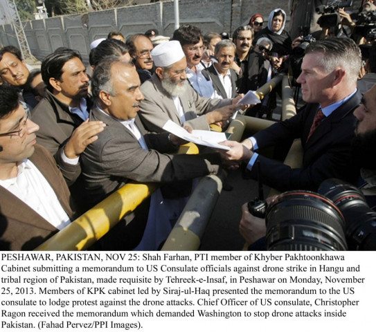 k p ministers and mpas from the ruling coalition marched to the us consulate in peshawar and presented a memorandum against drone attacks to a consulate official photo ppi k p ministers and mpas from the ruling coalition marched to the us consulate in peshawar and presented a memorandum against drone attacks to a consulate official photo ppi