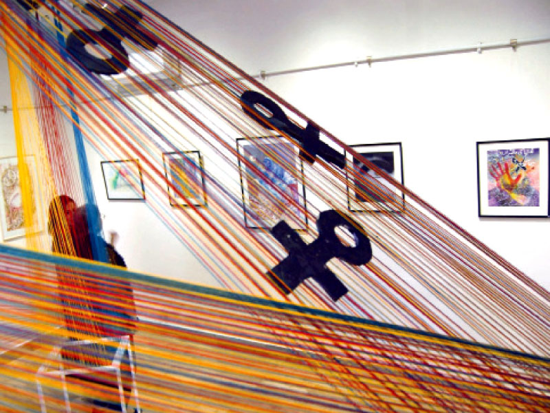 a giant installation set up in the middle of the hall calls attention to violence against women photo express