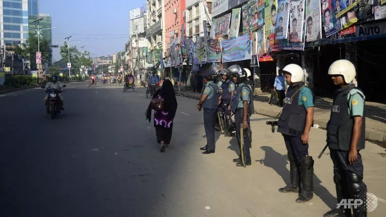 bangladeshi police personnel stand guard during the second day of a nationwide strike called by the opposition bnp in dhaka photo afp bangladeshi police personnel stand guard during the second day of a nationwide strike called by the opposition bnp in dhaka photo afp