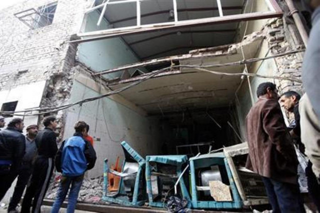 residents look at the site of bomb attacks at a cafe in baghdad 039 s sadriya district november 26 2013 photo reuters residents look at the site of bomb attacks at a cafe in baghdad 039 s sadriya district november 26 2013 photo reuters