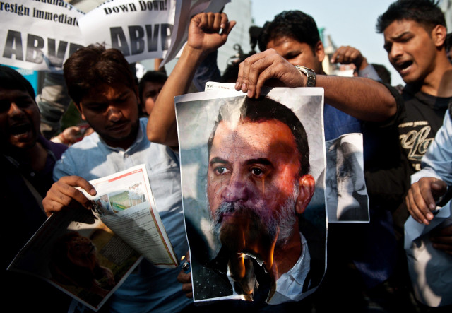 student activists burn a photograph of tejpal outside the magazine 039 s office photo afp student activists burn a photograph of tejpal outside the magazine 039 s office photo afp