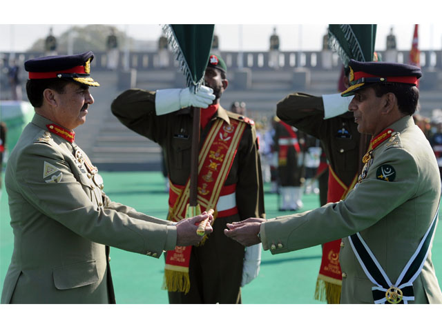 outgoing army chief general ashfaq kayani r presents the change of command baton to newly appointed army chief general raheel sharif l during the change of command ceremony in rawalpindi on november 29 2013 photo afp