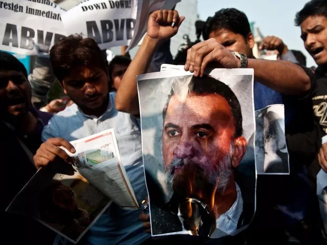 student activists burn a photograph of tejpal outside the magazine 039 s office photo afp student activists burn a photograph of tejpal outside the magazine 039 s office photo afp