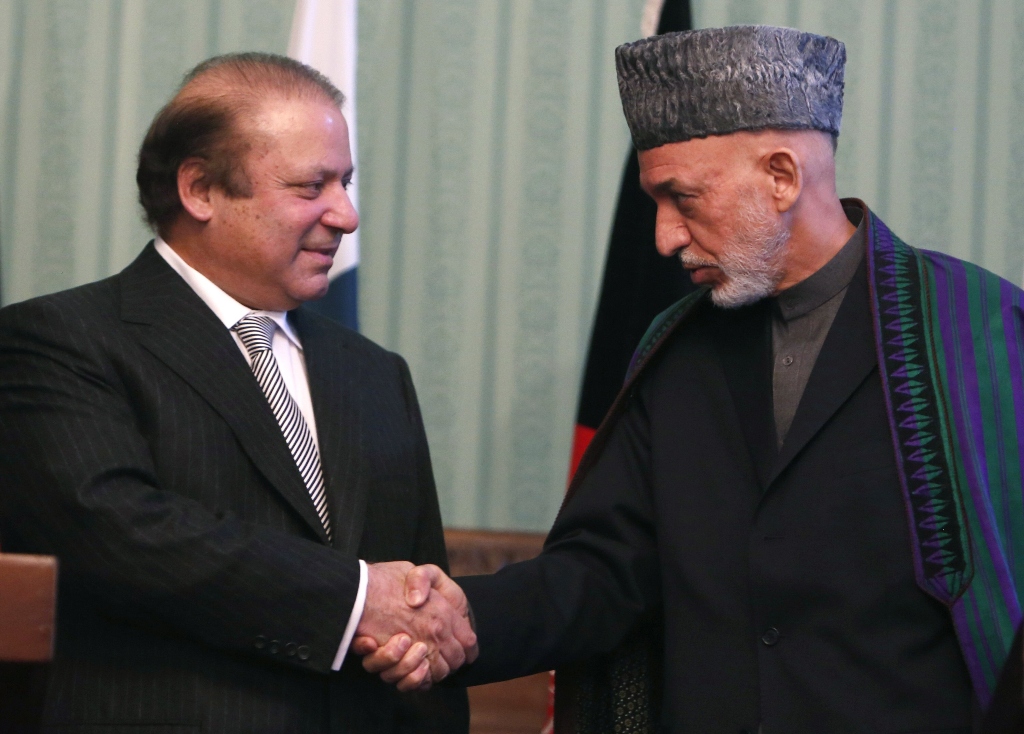 afghanistan 039 s president hamid karzai r shakes hands with prime minister nawaz sharif at a joint news conference in kabul photo reuters