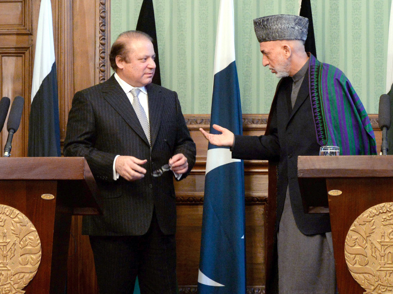 president hamid karzai speaks with prime minister nawaz sharif at the presidential palace in kabul photo afp