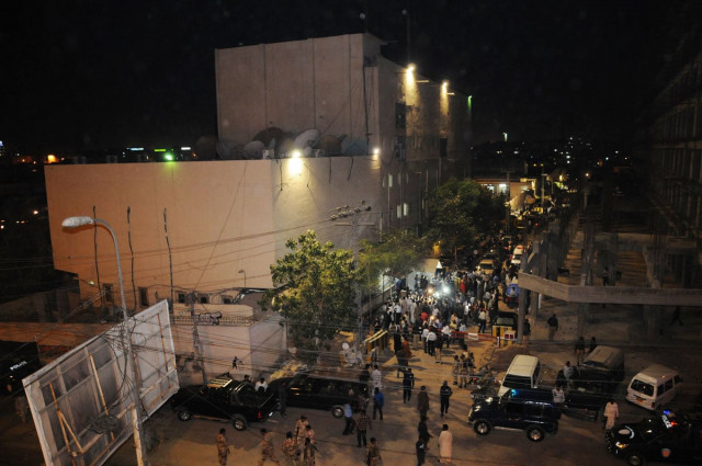 employees of the express media group and law enforcers gather at the site of the attack on monday evening the crackers were thrown from the bridge photo mohammad noman express employees of the express media group and law enforcers gather at the site of the attack on monday evening the crackers were thrown from the bridge photo mohammad noman express