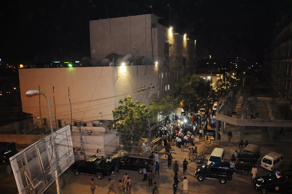 employees of the express media group and law enforcers gather at the site of the attack on monday evening the crackers were thrown from the bridge photo mohammad noman express employees of the express media group and law enforcers gather at the site of the attack on monday evening the crackers were thrown from the bridge photo mohammad noman express