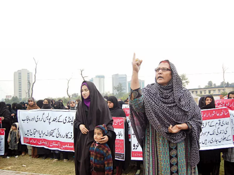 relatives of the arrested suspects chant slogans outside the national press club photo express javed relatives of the arrested suspects chant slogans outside the national press club photo express javed