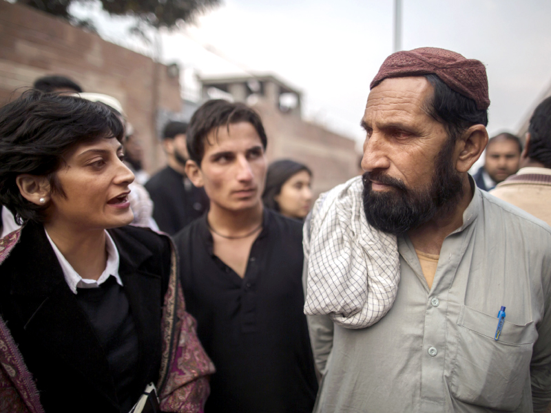 lawyer sarah bilal talks to wakeel khan the father of one of the prisoners hamidullah outside the central jail in peshawar on monday photo reuters