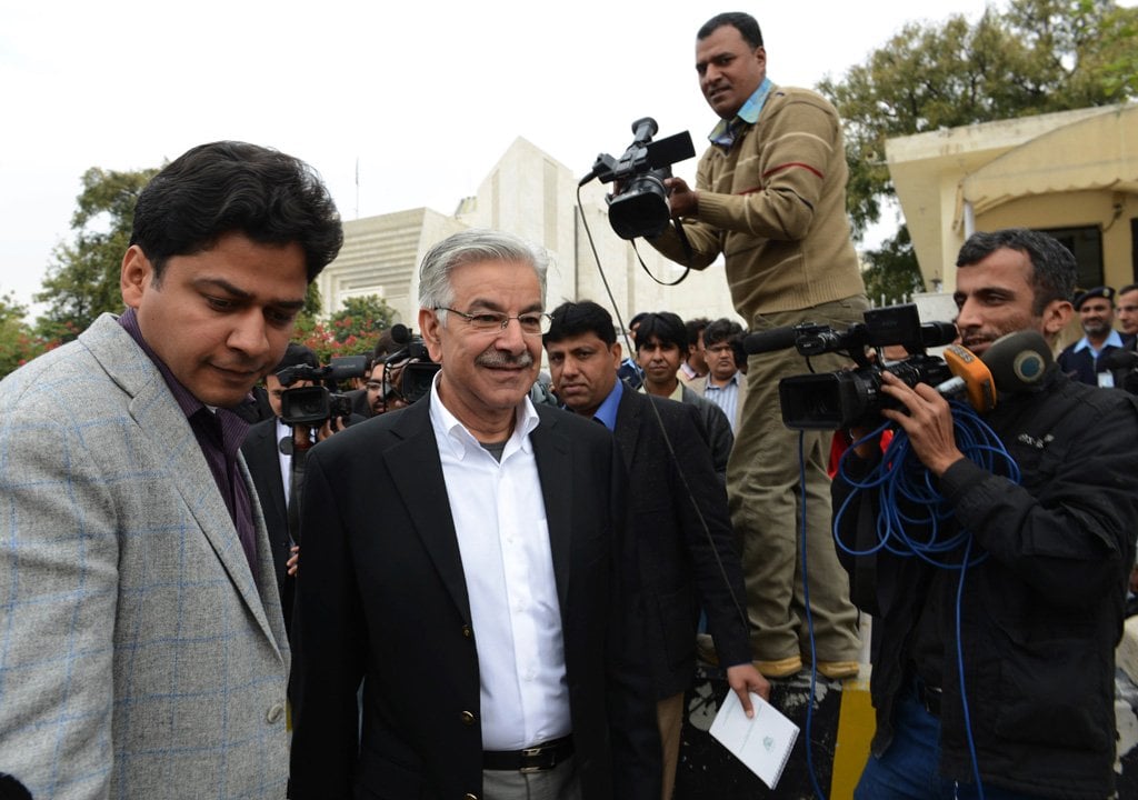 pakistan 039 s defence minister khawja asif c leaves the supreme court building after a hearing regarding missing persons in islamabad on december 2 2013 photo afp