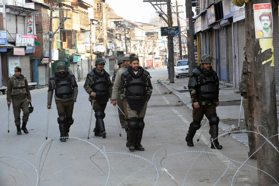 indian police patrol on a street in srinagar on february 10 2013 photo afp