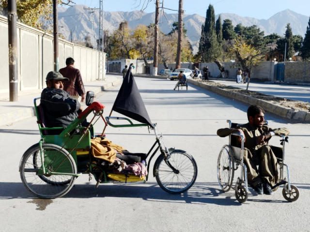 disabled men sit in their wheelchairs as they stage a protest demanding their rights outside the provincial chief minister s house in quetta photo afp disabled men sit in their wheelchairs as they stage a protest demanding their rights outside the provincial chief minister s house in quetta photo afp