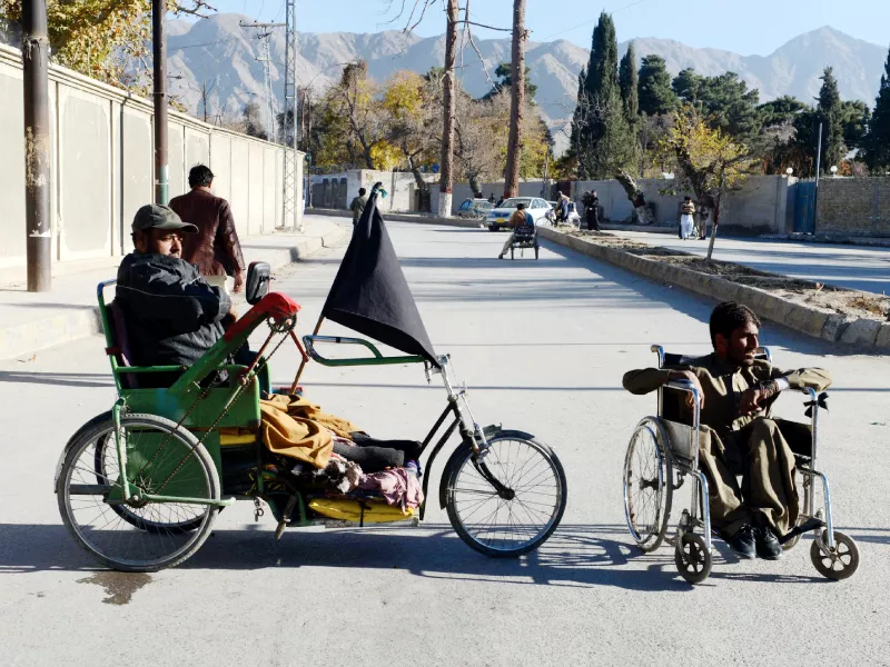 disabled men sit in their wheelchairs as they stage a protest demanding their rights outside the provincial chief minister s house in quetta photo afp disabled men sit in their wheelchairs as they stage a protest demanding their rights outside the provincial chief minister s house in quetta photo afp