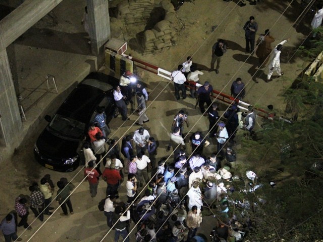 a crowd gathers at the front of the express news office after the attack photo ayesha mir express