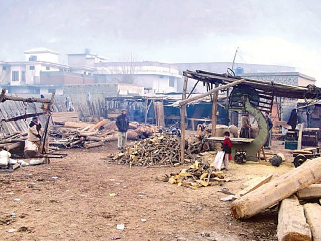 a firewood trader umair ali said that the jump in price of firewood was because of huge transportation cost photo file a firewood trader umair ali said that the jump in price of firewood was because of huge transportation cost photo file