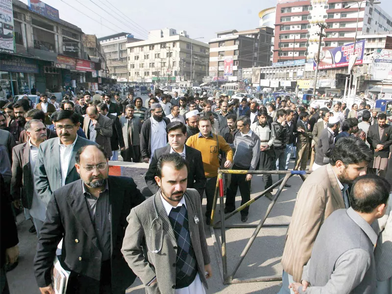 members of young doctors association protest at soe karno chowk near lady reading hospital on wednesday against kidnapping of doctors photo ppi members of young doctors association protest at soe karno chowk near lady reading hospital on wednesday against kidnapping of doctors photo ppi