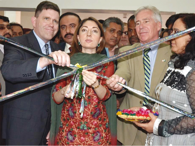 us consul general michael dodman and provincial adviser sharmila farooqi cut the ribbon at lincoln corner library in qasimabad on thursday photo courtesy us embassy in karachi