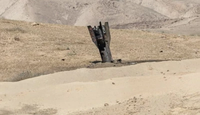 part of a missile protrudes from the ground following strikes from iran in the israeli occupied west bank photo reuters